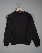 18 gauges cashmere and silk crew neck sweater. A thin, soft and precious garment to keep as an anchor piece in your everyday wardrobe essentials.  70% Cashmere 30% Silk Crew neck Article: 43167/15390 Color: 099 / Black Made in Italy