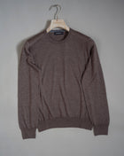 18 gauges cashmere and silk crew neck sweater. A thin, soft and precious garment to keep as an anchor piece in your everyday wardrobe essentials.  70% Cashmere 30% Silk Crew neck Article: 43167/15390 Color: 170 / Brown1 Made in Italy
