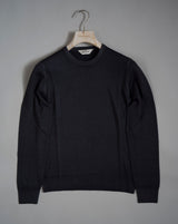 Gran Sasso Vintage merino wool knit. It has been garment dyed to achieve nice vintage look. This means it has more vivid compared to yarn dyed knitwear.   Vintage Merino is a core quality in our Gran Sasso collection. We offer a lighter quality for spring/summer and heavier for autumn/ winter season.   Crew neck 100% merino wool Vintage washed (garment dyed) Ribbed hem and cuffs Fashion fit Article: 55167/22792 Colore: 099 / Black Made in Italy