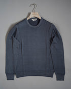 Gran Sasso Vintage merino wool knit. It has been garment dyed to achieve nice vintage look. This means it has more vivid compared to yarn dyed knitwear.   Vintage Merino is a core quality in our Gran Sasso collection. We offer a lighter quality for spring/summer and heavier for autumn/ winter season.   Crew neck 100% merino wool Vintage washed (garment dyed) Ribbed hem and cuffs Fashion fit Article: 55167/22792 Colore:   011 / Light Gray Made in Italy