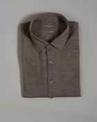 Gran Sasso Travel Wool full buttoned shirt. Travel Wool is a machine-washable and tumbler-dry extra-fine merino yarn, stain-resistant with eco-idro treatment and, thanks to the tight and narrow weave of the yarn, it is extremely resistant to wear and pilling.  Long Sleeves Full buttoned 100% Merino Travel wool Art.  60122/69001 Col. 119 / Mid Brown with Mélage effect Made in Italy