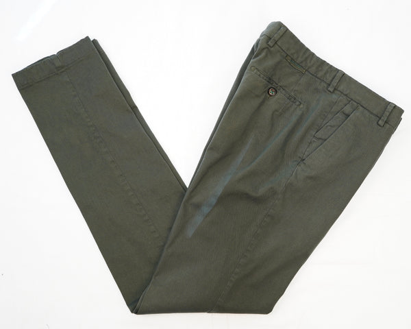 This kind of cotton trouser are one of the corner stones of every man’s casual wardrobe, the slim fit chino. These are made in a slim cut and garment dyed and washed which give the trousers a beautiful and unique colour. These are the trousers that go with everything from t-shirts to jackets  98% Cotton 2% Elastan Color: Militare military green Button closure with zippered fly Changeable button in front Slanted front pockets and two back pockets Model: Morello  Article: xgab Made in Martina Franca, Italy