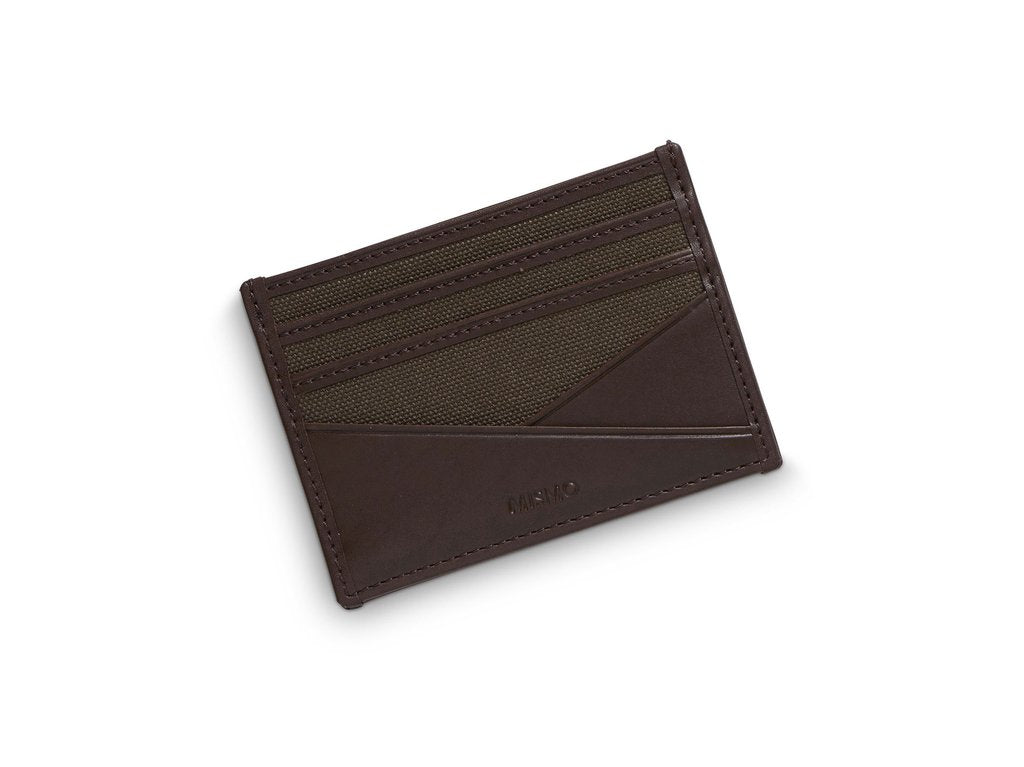 An everyday essential. Canvas/leather cardholder with 3 slots for credit cards on each side. Open pocket in the middle for bills, notes etc.  Measurements: L: 10  H: 7,5  W: 0,5cm Body: Tight-woven cotton canvas Fabric composition: CO 94% PU 4% PC 2% - 709 gr/rm Trimmings: Custom developed dark brown vegetable tanned full-grain bridle leather  Lining: 100% cotton in Army colour  Art. no. MS090112