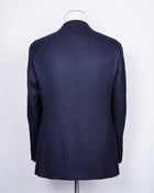 caruso full canvas Fully lined Unconstructed shoulder 3 roll 2 buttoning Side vents Notch lapel Patch pockets Composition: 100% wool Color: Blue melangé Modello: Aida / ASM2JM304F Article: 500382 Colore: 0150 Made in Italy