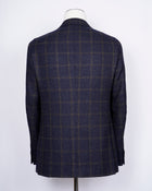 caruso full canvas Fully lined Unconstructed shoulder 3 roll 2 buttoning Side vents Notch lapel Patch pockets Composition: 72% wool, 25%coton, 3% cashmere Color: Navy and Brown Modello: Aida / ASM2JM304F Article: 505179 Colore: 0120 Made in Italy