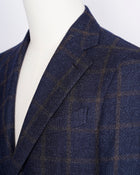 caruso full canvas Fully lined Unconstructed shoulder 3 roll 2 buttoning Side vents Notch lapel Patch pockets Composition: 72% wool, 25%coton, 3% cashmere Color: Navy and Brown Modello: Aida / ASM2JM304F Article: 505179 Colore: 0120 Made in Italy