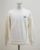 C.P. Company sweatshirt with 50th anniversary Cinquanta-logo.  Crewneck construction Long sleeve Ribbed cuffs and hem 100% Makó Cotton Fits true to the size 11CMSS320A 005388W Col. 103 / White