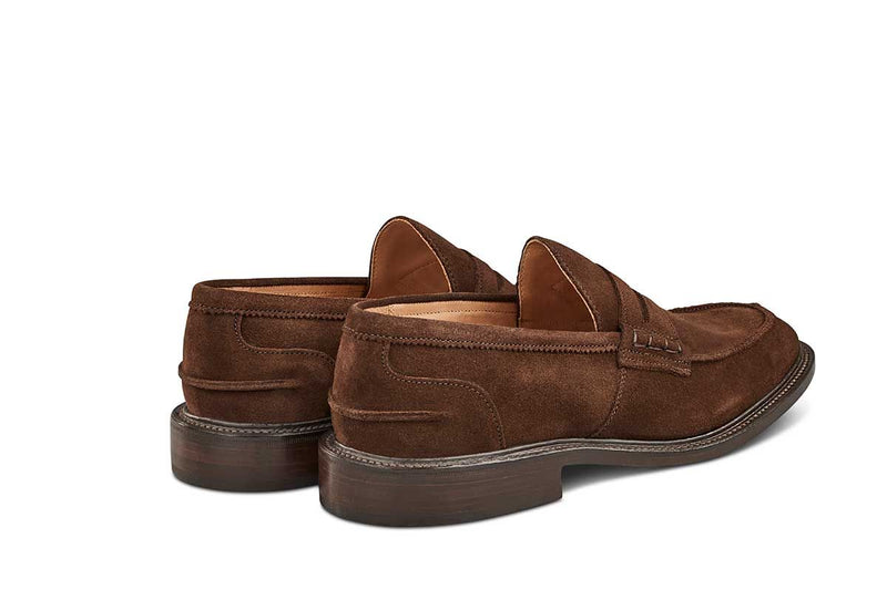 Tricker’s classic step in Penny loafer combines comfort with quiet confidence. In chocolate Repello suede with storm welt, leather uppers and linings for even greater refinement, channelled and stitched leather sole. Tricker's James Suede Penny Loafer / Chocolate