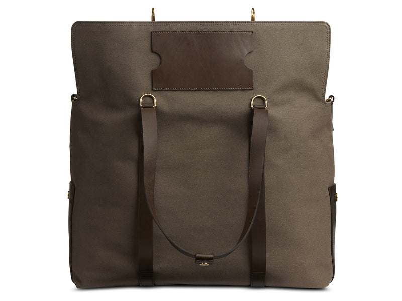 Measurements: L: 46 H: 34 W:18 cm Body: Tight-woven cotton canvas Fabric composition: CO 94% PU 4% PC 2% - 709 gr/rm Trimmings: Dark brown vegetable tanned full-grain bridle leather Lining: 100% cotton in Army colour Hardware: Solid brass with varnish protection Zipper: Hand Polished YKK Excella Art. No. MS110110 travel bag, or bend flaps down for a large, open city tote bag. A full-grain leather pocket on each gusset adds extra durability to the bottom corners