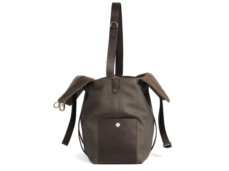 Measurements: L: 46 H: 34 W:18 cm Body: Tight-woven cotton canvas Fabric composition: CO 94% PU 4% PC 2% - 709 gr/rm Trimmings: Dark brown vegetable tanned full-grain bridle leather Lining: 100% cotton in Army colour Hardware: Solid brass with varnish protection Zipper: Hand Polished YKK Excella Art. No. MS110110 travel bag, or bend flaps down for a large, open city tote bag. A full-grain leather pocket on each gusset adds extra durability to the bottom corners