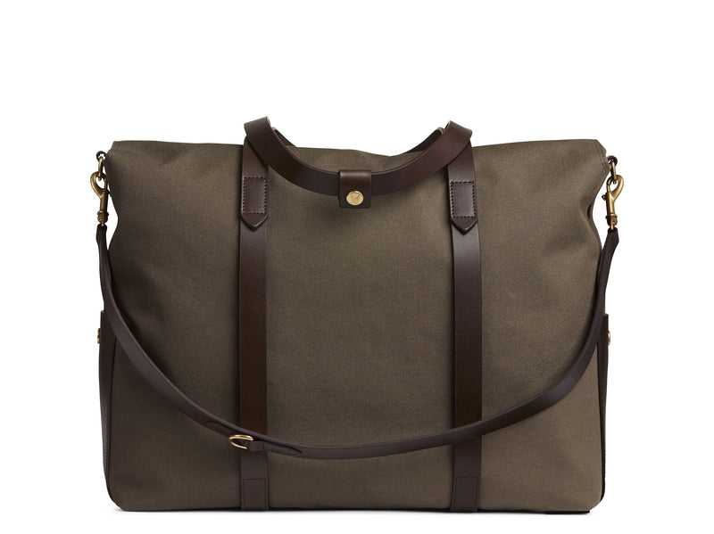 Measurements:  L: 46  H: 34  W:18 cm Body: Tight-woven cotton canvas Fabric composition: CO 94% PU 4% PC 2% - 709 gr/rm Trimmings: Dark brown vegetable tanned full-grain bridle leather  Lining: 100% cotton in Army colour Hardware: Solid brass with varnish protection Zipper: Hand Polished YKK Excella  Art. No. MS110110 travel bag, or bend flaps down for a large, open city tote bag.  A full-grain leather pocket on each gusset adds extra durability to the bottom corners