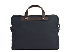 Measurements:  L: 39  H: 29  W: 8cm Body: Waterproof hard woven Italian nylon  Fabric composition: PA 42% CO 38% PU 20%  /  826g pr/m Trimmings: Dark brown custom developed vegetable tanned full-grain bridle leather Lining: 100% cotton in navy colour  Hardware: Solid brass with varnish protection  Zipper: Hand polished YKK Excella Art. No. MS461315 A softer and more casual counterpart to the M/S Briefcase, the M/S Office is designed with dual front pockets that zip open into one large compartment