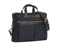 Measurements:  L: 39  H: 29  W: 8cm Body: Waterproof hard woven Italian nylon  Fabric composition: PA 42% CO 38% PU 20%  /  826g pr/m Trimmings: Dark brown custom developed vegetable tanned full-grain bridle leather Lining: 100% cotton in navy colour  Hardware: Solid brass with varnish protection  Zipper: Hand polished YKK Excella Art. No. MS461315 A softer and more casual counterpart to the M/S Briefcase, the M/S Office is designed with dual front pockets that zip open into one large compartment