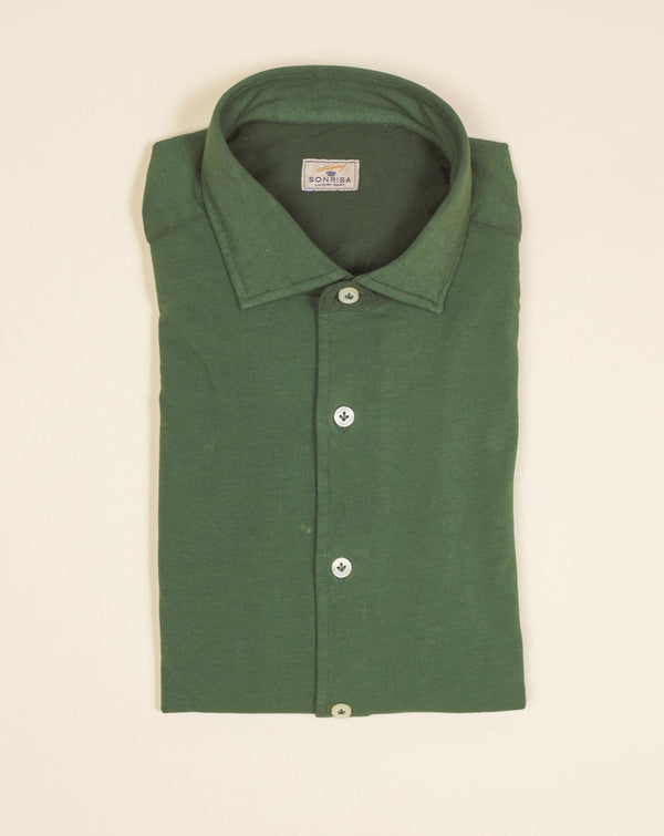 Jersey shirts are very comfortable and this shirt makes no exemption. It looks like dress shirt and feels like knitwear. We think this kind of garments represent modern tailoring very well. They honor classic styles and lines, but they are made to be super comfortable and practical.   100% cotton Semi cutaway collar Single cuffs Removable collar bones Model. TJ08/IN Article. J119 Color. V19 / Forest Green