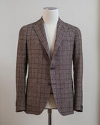 Tagliatore jacket with a easy to combine brown checkered look.  You can find the measurement chart for Tagliatore HERE  Slim fit. Take your normal size.  If in doubt about your size, please contact us HERE Unlined Unconstructed shoulder 2 Buttons Side vents Notch lapel Patch pockets Composition: 50% viscose / 33% wool / 17% polyamide Modello: 1SMC22K Article: 120058 W Colore:T301 Made in Italy