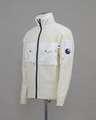 - Ribbed Trims - Lens Detail Sleeve Pocket - Stand Collar - Full Zip Fastening - One Vertical Chest Pocket - One Horizontal Chest PocketArt. 13CMKN281A 005504M Col. 103 / Gauze White C.P. Company Knit Lambswool Cardigan / Gauze White