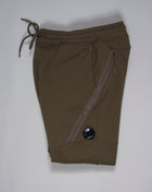 C.P. Company's diagonal raised fleece is a mid-weight option that's woven from a soft loopback cotton, for premium comfort with a durable, rugged feel.  Side slip pockets Lens detail Cargo Pocket on left side Tapered fit Adjustable drawstring waist Art. 13CMSP064A 005086W Col. 683 / Olive Green 100% cotton