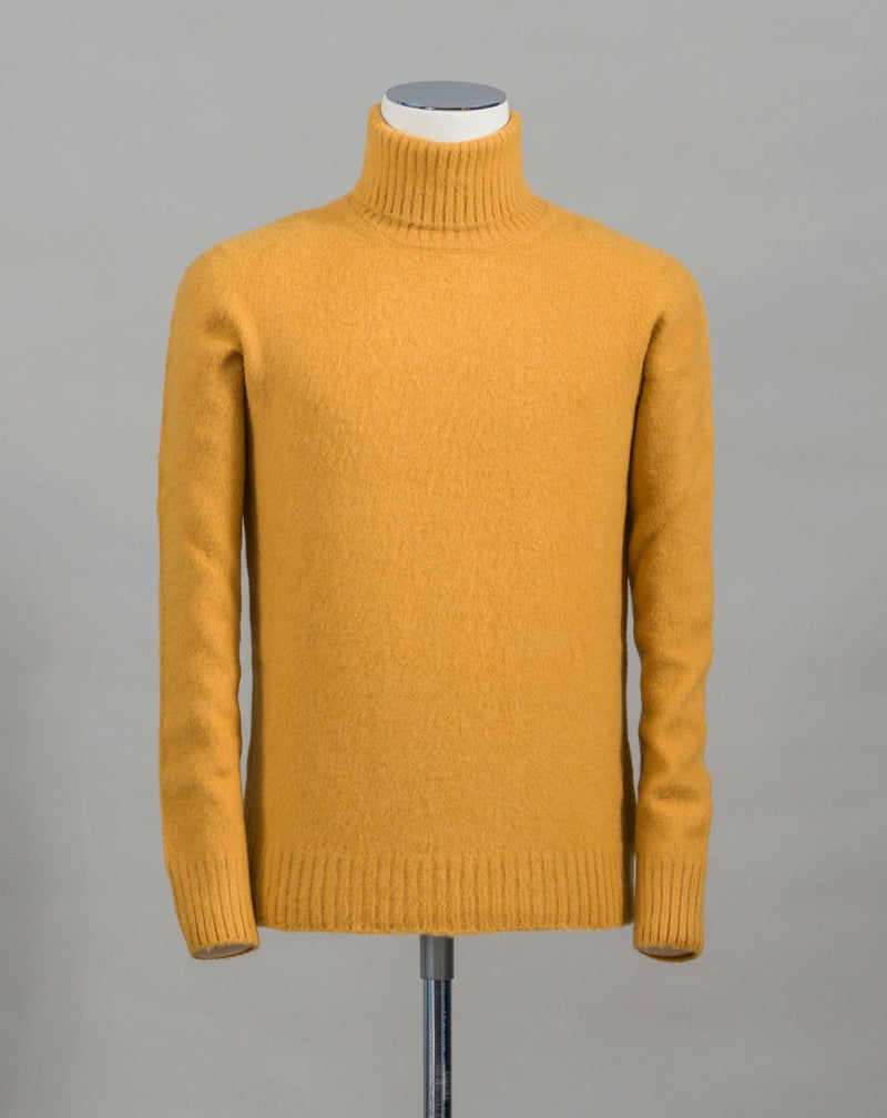 Gran Sasso brushed wool roll neck. Material of this garment has been brushed 6 times to give it extra soft touch and warm, wooly feeling.  Art.  24196/18801 Col. 321 / Yellow 100% Wool Made in Italy 