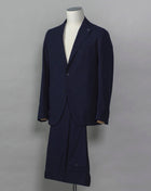 Tagliatore Seersucker summer suit.  Unlined jacket and unconstructed shoulders combined with this iconic summer fabric are guaranteed to keep you comfortable even on the hottest summer parties.  Composition: 96% Cotton 3% Elastan Bistretch 1% Polyamide (Nylon) Modello: 2SMC22K01 Color: Navy / B1185 Unconstructed Unlined 2 Buttons Notch lapel Patch pockets Side vents Flat front Belt loops Made in Martina Franca, Italy