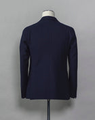 Tagliatore Seersucker summer suit.  Unlined jacket and unconstructed shoulders combined with this iconic summer fabric are guaranteed to keep you comfortable even on the hottest summer parties.  Composition: 96% Cotton 3% Elastan Bistretch 1% Polyamide (Nylon) Modello: 2SMC22K01 Color: Navy / B1185 Unconstructed Unlined 2 Buttons Notch lapel Patch pockets Side vents Flat front Belt loops Made in Martina Franca, Italy