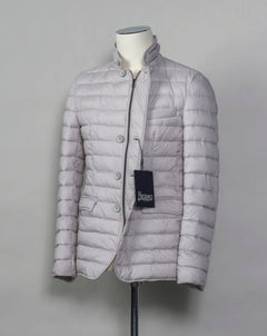 In-Tech™ Alternative Down Light insulation Water repellent Breathable External layer 100% Polyamide Internal padding 100% Polyester Light insulation Buttons and Zip fastening in front Notch lapel Straight flap pockets Center vent PC002ULE 19288 Color: 1300 Made in Romania Herno In-Tech™ Alternative Down jacket. Very versatile outerwear piece that works just as good on both spring and fall or when ever it is a bit chilly.