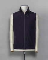 Montecore light down vest. Four zippered pockets outside and 2 inside. Light weight hood folded inside the collar. Article: S04MUWX725 Fabric: Solotex® 100% Polyester Lining: 100% Polyamide Filling: 90% Down 10% Feathers Color: 89 / Navy