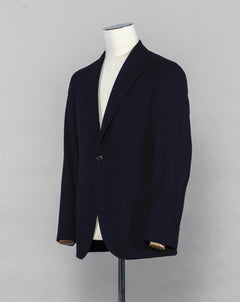 Caruso blazer impeccably tailored in Soragna, Parma, Italy. Stunning lightness and ease of movement without losing the classic tailored elegance. These are some of the ingredients that make Italian tailoring world famous and you can find it all in Caruso garments.  Beautiful handmade detailing and naturally with a full canvas structure inside.  Full canvas Half lined  Unconstructed shoulder Mod. Aida 100% wool Col. 0110 / Navy