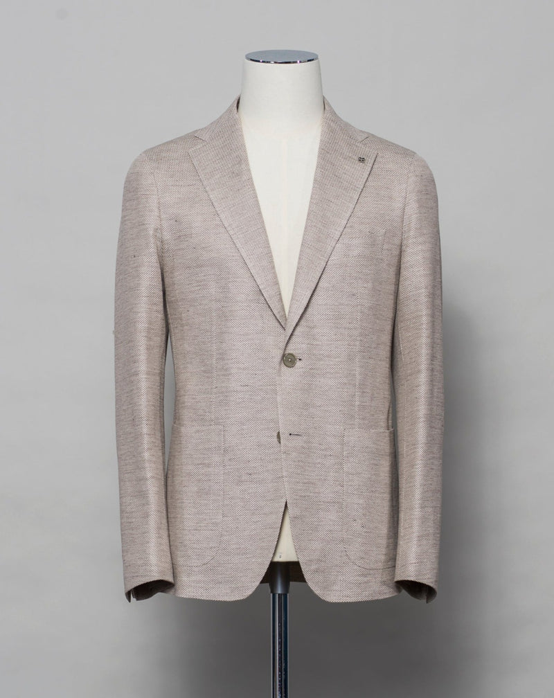 Tagliatore linen/cotton jersey blazer. Model Montecarlo, which is familiar to most of our regular customers. Slim fit with light unconstructed make. Comfortable to wear and easy to combine with almost anything.  If in doubt of your size, please contact us HERE.  Composition: 59% Linen 41% Cotton Modello: Monte Carlo / 1SMJ22K - PE Color: Light Beige / A1324 Unconstructed Unlined 2 Buttons Notch lapel Patch pockets Side vents Made in Martina Franca, Italy