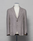 Tagliatore linen/cotton jersey blazer. Model Montecarlo, which is familiar to most of our regular customers. Slim fit with light unconstructed make. Comfortable to wear and easy to combine with almost anything.  If in doubt of your size, please contact us HERE.  Composition: 42% Linen 21% Silk 21% Wool 15% Cotton 1% Elastan Modello: Monte Carlo / 1SMC22K Color: Brown & Cream / T3143 Unconstructed Unlined 2 Buttons Notch lapel Patch pockets Side vents Made in Martina Franca, Italy