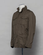 This Herno jacket honors the iconic M65 field jacket. Practical design with quite a few pockets, action back and adjustable waist. Why change the winning team.  4+2 pockets outside (2 hidden pockets) 2 pockets inside  Adjustable waist 2 way zip and snap buttons in front Hidden hood inside the collar  100% Cotton Washed effect  FI0064U 13211 7730
