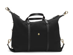 Measurements:    L: 42(52)  H: 31(41)  W: 12(4) cm Body: Waterproof hard woven Italian nylon  Fabric composition: PA 42% CO 38% PU 20%  /  826g /m Trimmings: Dark brown custom developed vegetable tanned full-grain bridle leather Lining: 100% cotton in army colour  Hardware: Solid brass with varnish protection  Zipper: Hand polished YKK Excella Art. No. MS121312 A flexible duffle/work bag that can be adjusted in size by attaching the snap hooks in each corner of the bag to the brass D-rings on the gusset. 