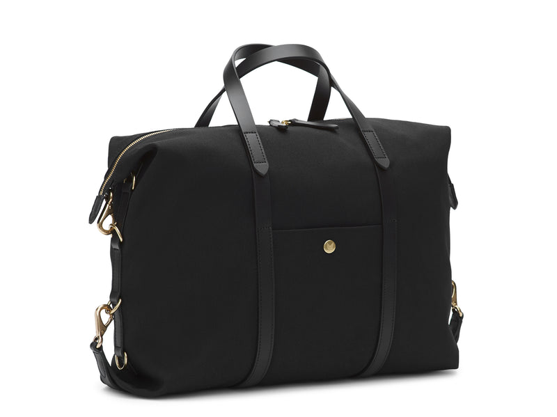 Measurements:    L: 42(52)  H: 31(41)  W: 12(4) cm Body: Waterproof hard woven Italian nylon  Fabric composition: PA 42% CO 38% PU 20%  /  826g /m Trimmings: Dark brown custom developed vegetable tanned full-grain bridle leather Lining: 100% cotton in army colour  Hardware: Solid brass with varnish protection  Zipper: Hand polished YKK Excella Art. No. MS121312 A flexible duffle/work bag that can be adjusted in size by attaching the snap hooks in each corner of the bag to the brass D-rings on the gusset. 